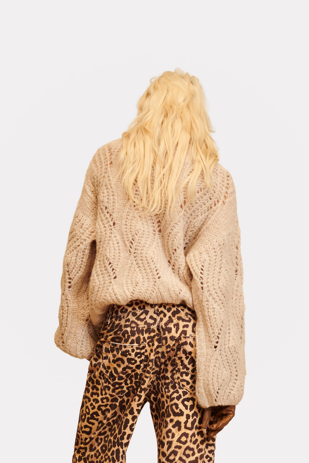 Jersey corto de punto calado beige con mangas abullonadas
