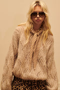 Jersey corto de punto calado beige con mangas abullonadas